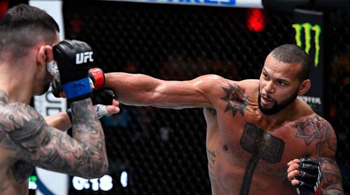 Mar 6, 2021; Las Vegas, NV, USA; Thiago Santos of Brazil punches Aleksandar Rakic of Austria in their light heavyweight fight during the UFC 259 event at UFC APEX on March 06, 2021 in Las Vegas, Nevada.